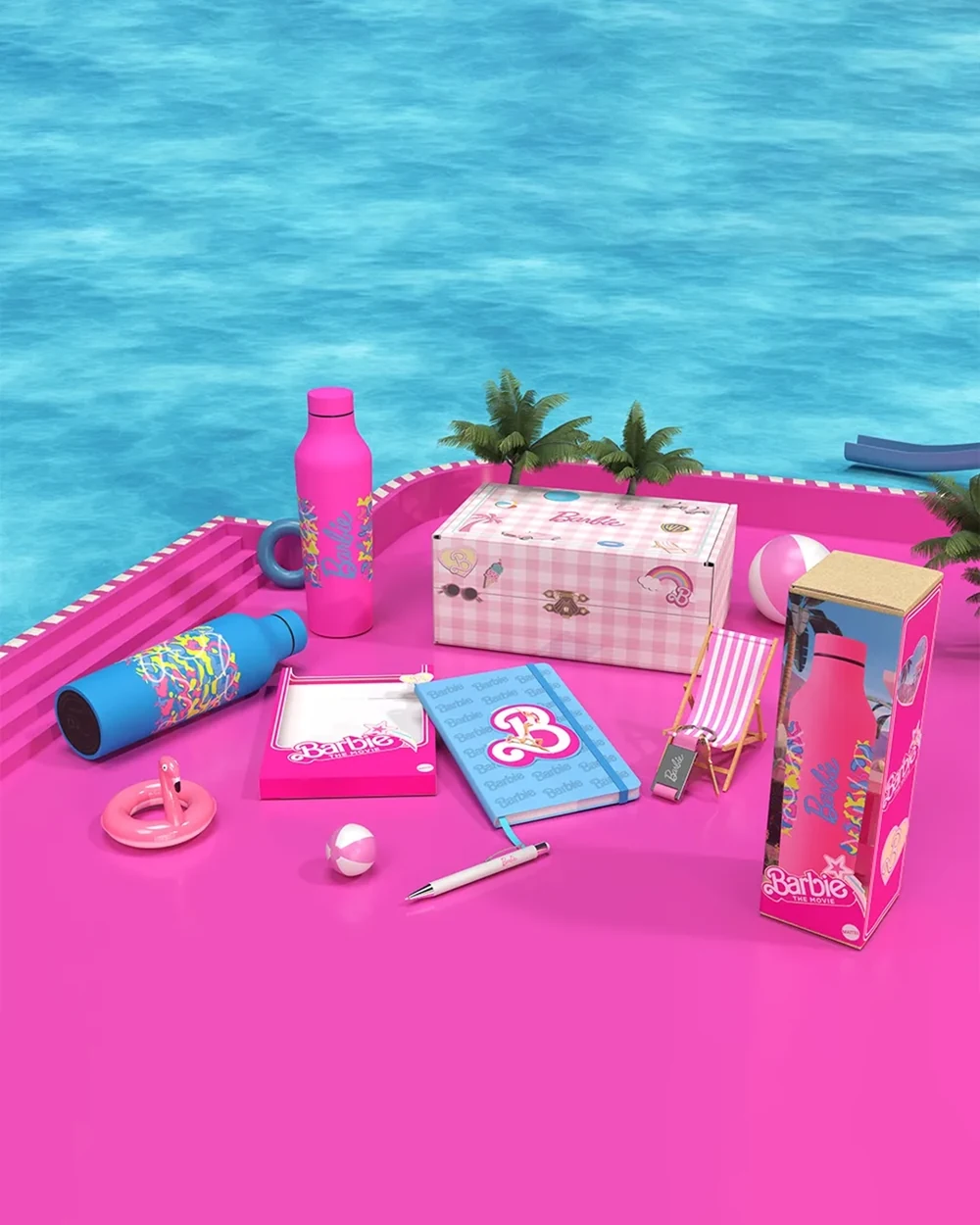 Pink gift items on a bright pink surface beside blue water and palm trees